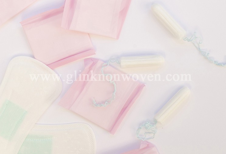 How do sanitary napkin factories control raw materials?